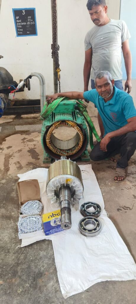 Skilled technician fixing damaged electric motor